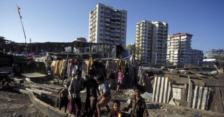 Kalyan-Dombivli Municipal Corporation officials supervising the demolition process.